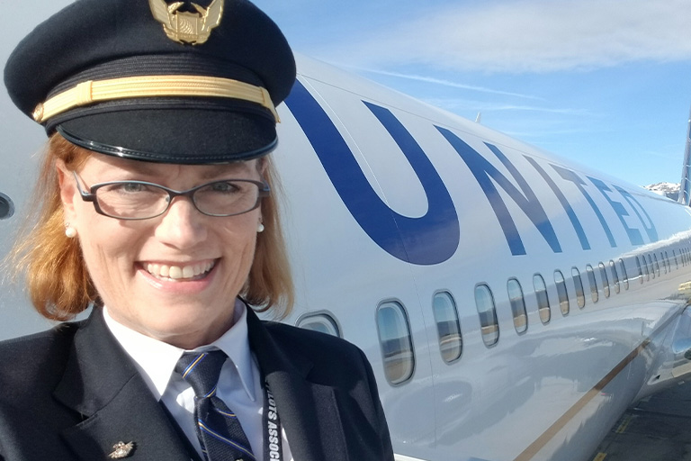Dee Ketterer boarding United Airlines jet as pilot
